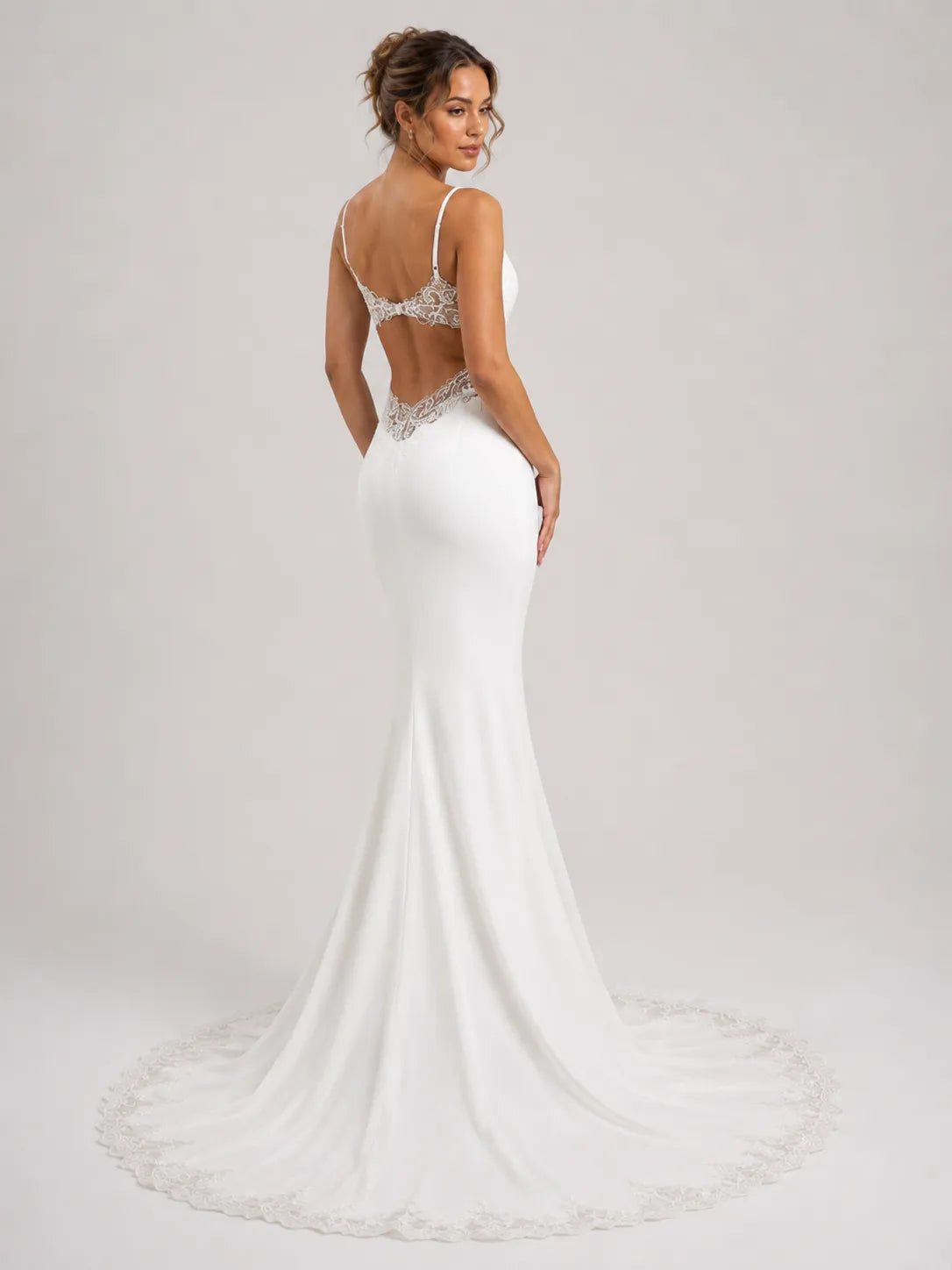 Elegant Spaghetti Strap Mermaid Wedding Dress with Lace Cutouts and Open Back