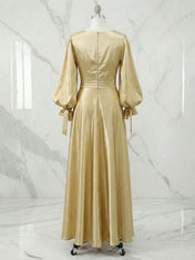 Champagne Long Sleeve Ruched Waist Flowing Evening Gown