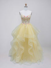 Gelbes gestuftes Tüll-Ballkleid mit floral besticktem, transparentem Korsett